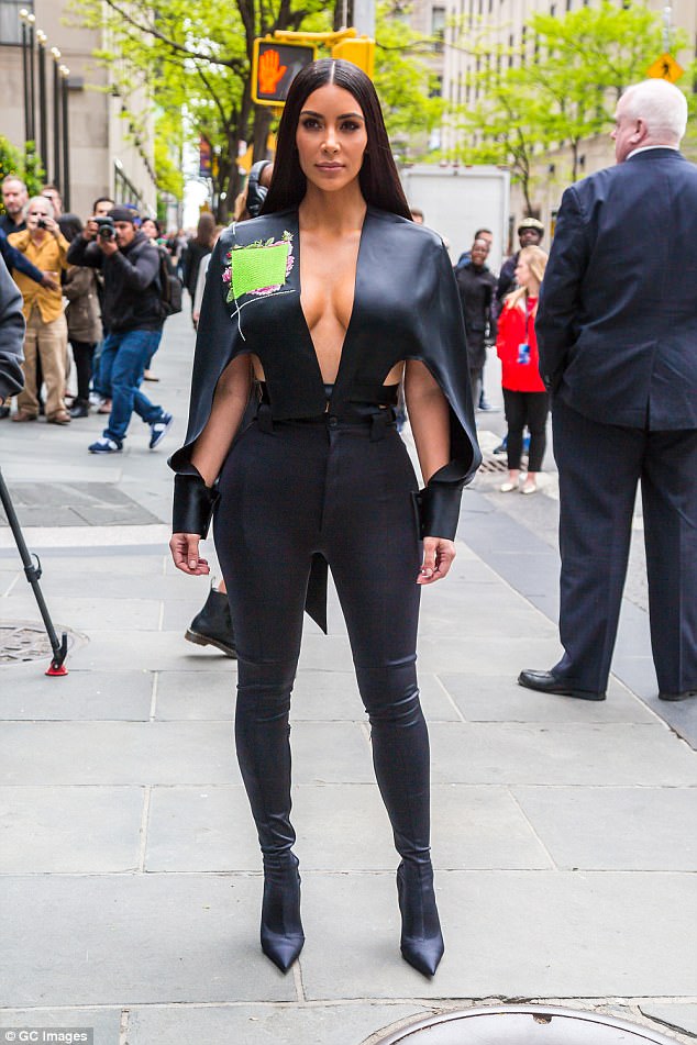 Getting comfortable! Kim Kardashian swaps sexy superhero catsuit for cosy sweats as she steps out in New York