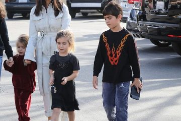 Kourtney Kardashian cuts a chic figure in all white for lunch outing with kids