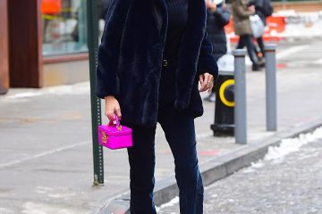 Gigi Hadid cuts effortlessly cool figure as she faces icy NYC in furry blue coat and neon pink purse