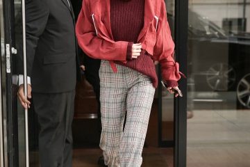 Gigi Hadid grins as she dons crimson jacket and sweater while seen for the first time since shock split with Zayn Malik